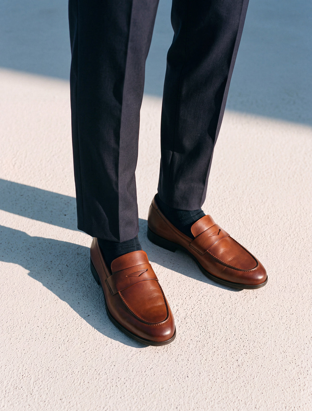 Capital Loafer in Whiskey worn with navy trousers