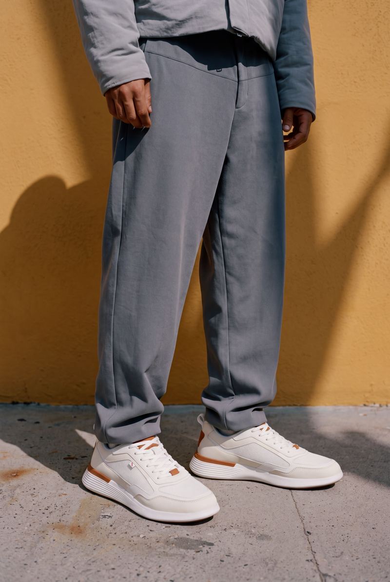 Crossover Runner Sport in White against a yellow wall