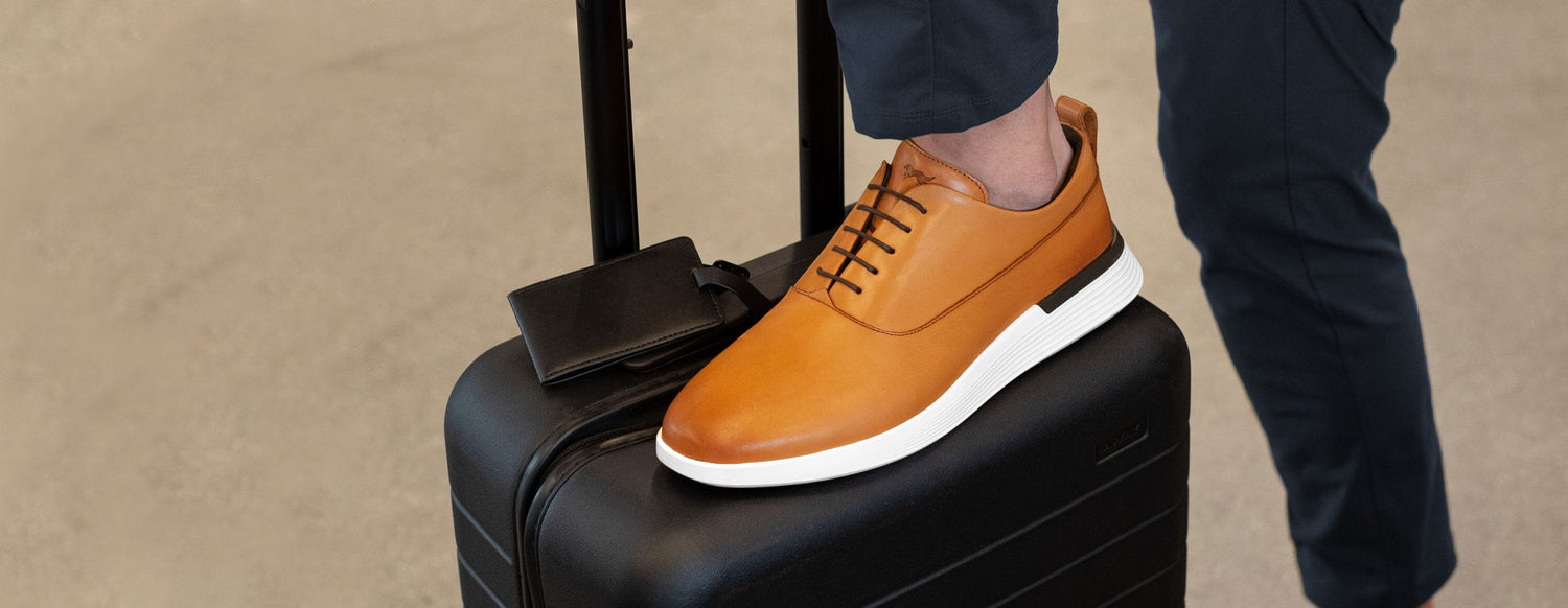 Leather shoe on suitcase
